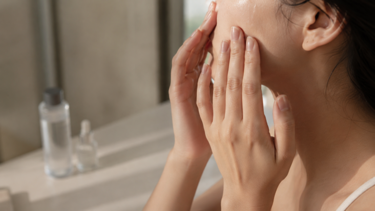 Vietnamese skincare routine — hands applying lightweight serum, morning window light